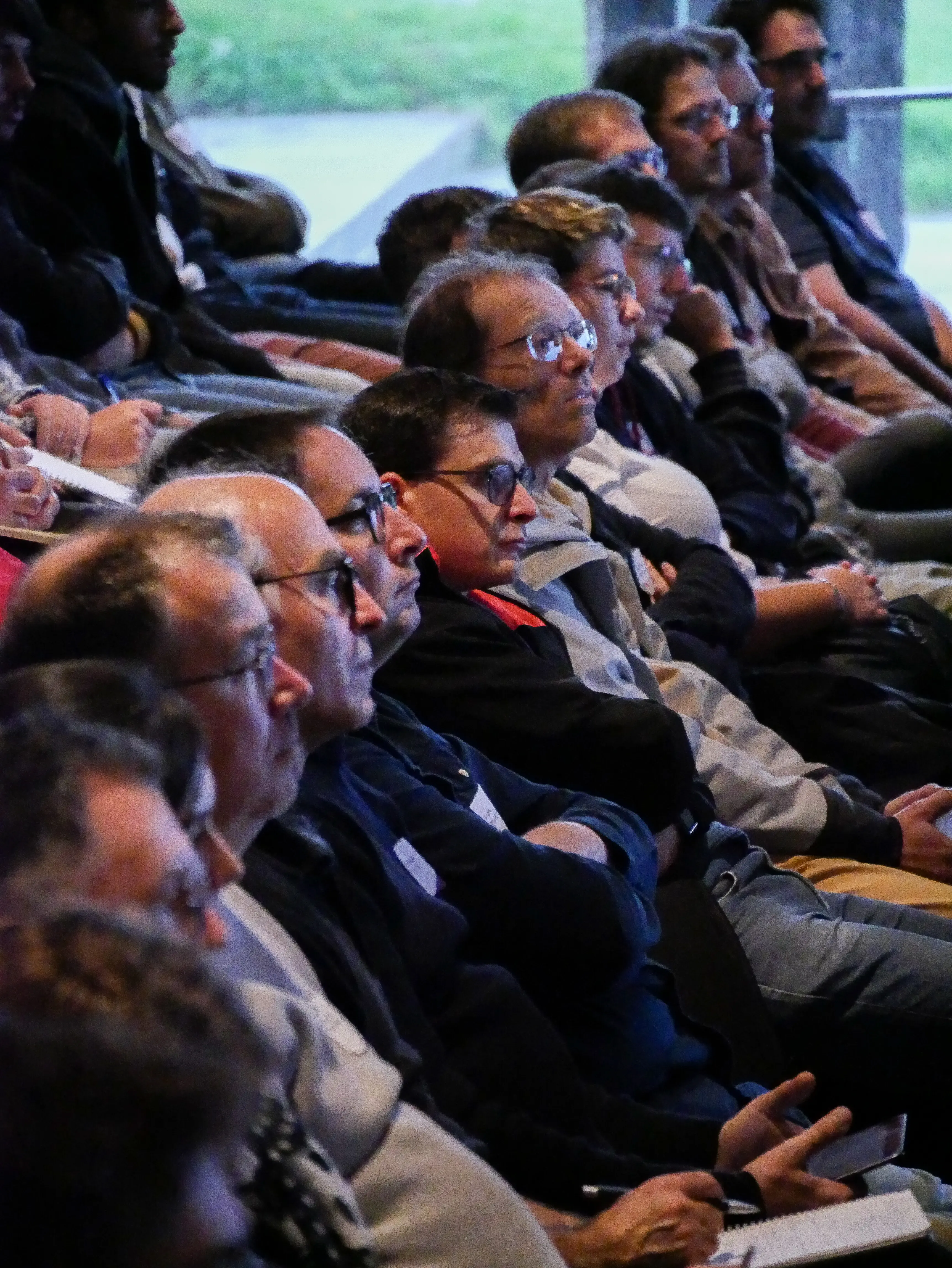 Attendee taking notes during a conference session